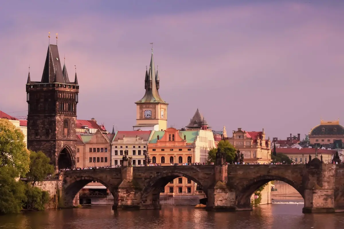 Charles Bridge over Vltava River, offering a stunning view of Prague's picturesque skyline