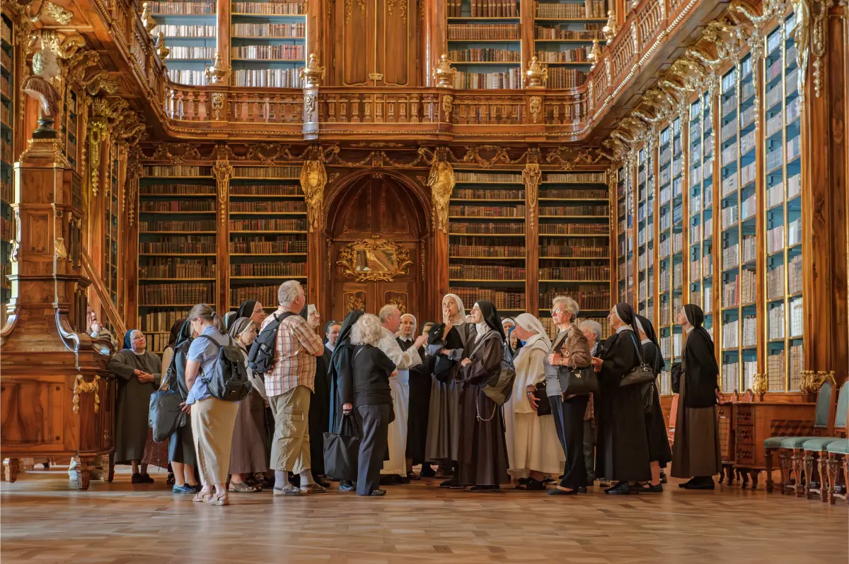 Philosophical Hall in Strahov Monastery, bustling with international visitors