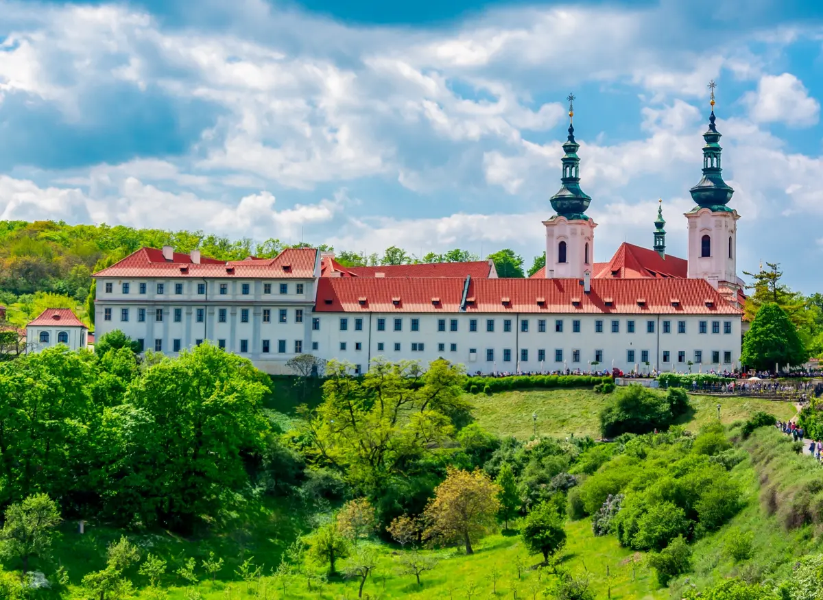 Strahov Monastery in Prague framed by lush greenery