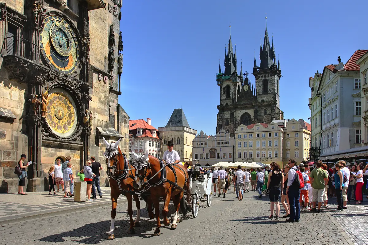 Tourist carriage near Tyn Church and Astronomical Clock at Old Town Square